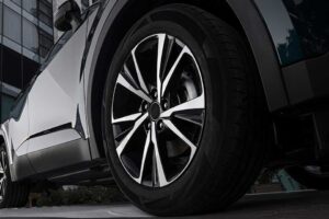 Car showroom. Aluminum wheel with Tire. automobile wheel tire. aluminium rims. Motor Corporation is Japanese automotive manufacturer.